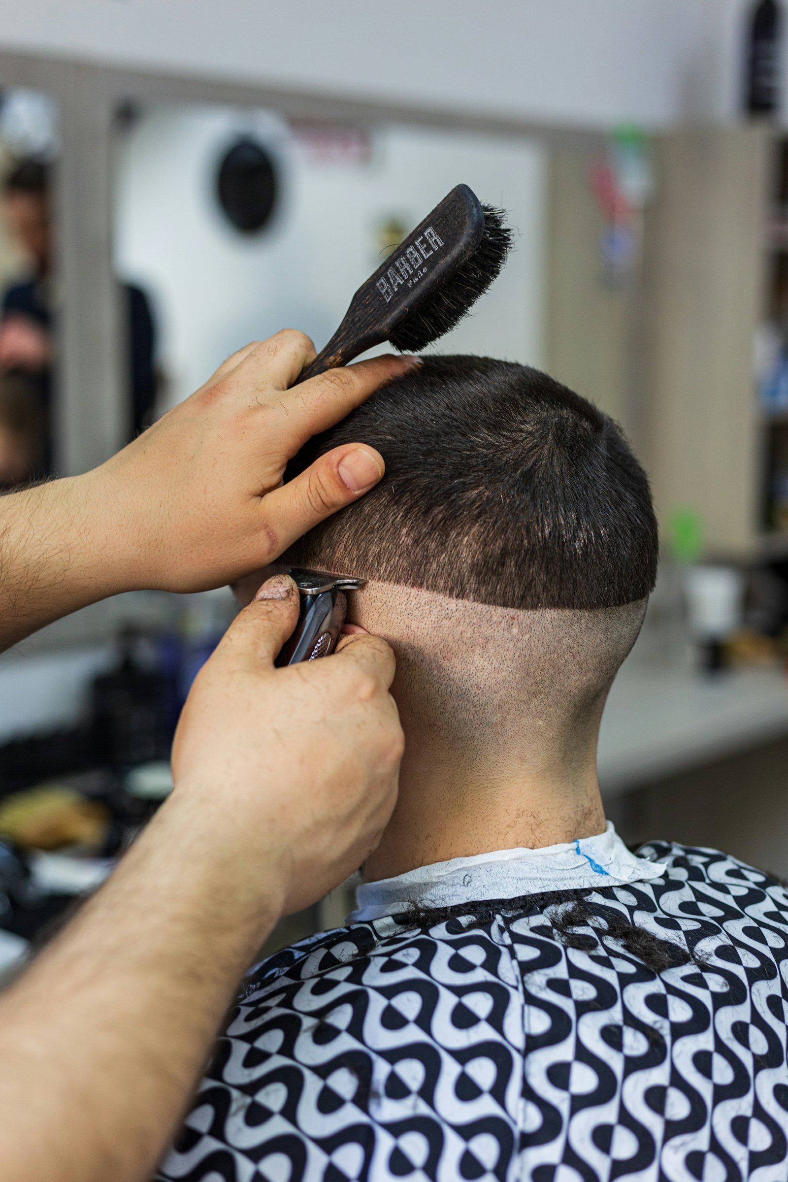 Professional barber cutting a client’s hair