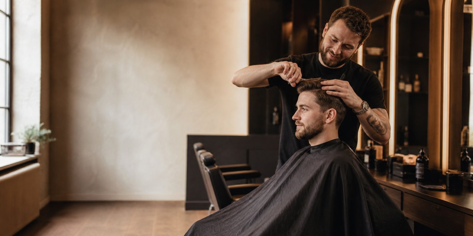 Professional barber providing a precision haircut in a modern salon